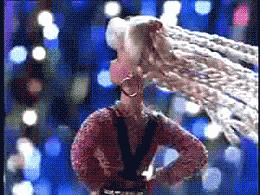 Scene from a commercial where a Barbie doll flips her hair and shimmies